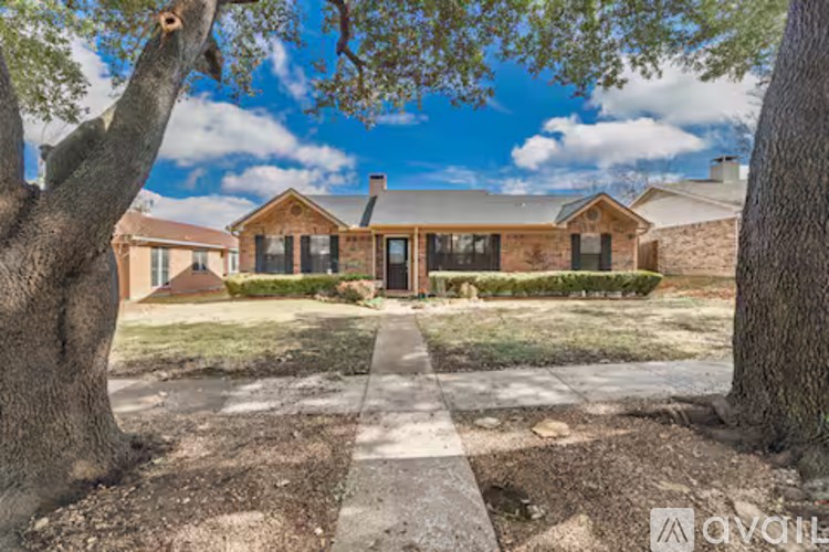 A house is for sale in a residential area.