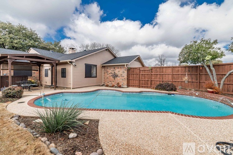 A house with a pool in the backyard.