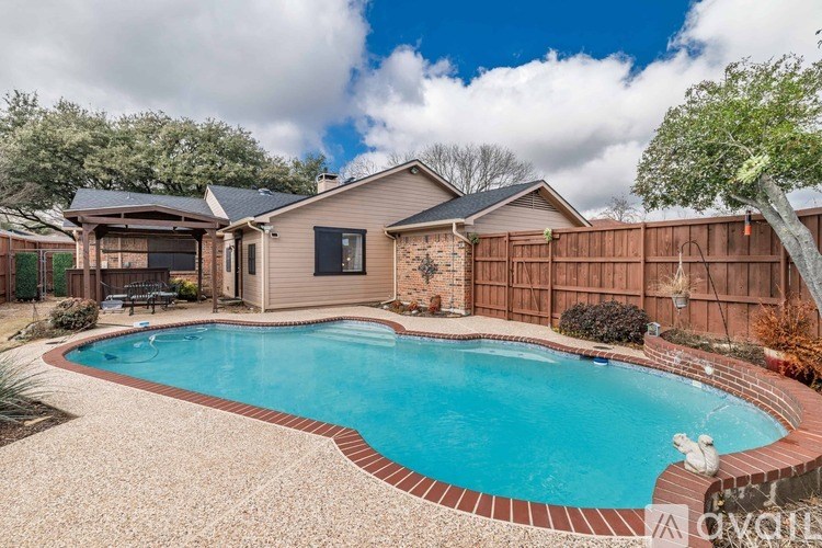 A house with a pool in the backyard.