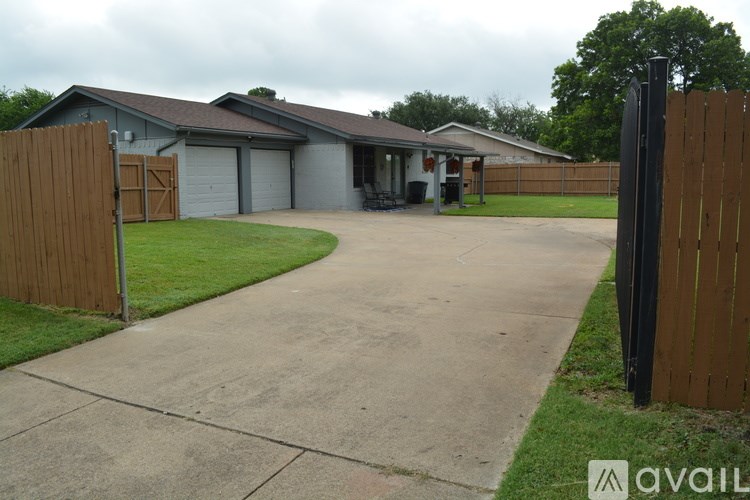 A house with a garage and a driveway.