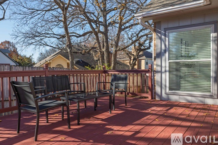 A patio with two chairs and a table is available for rent.