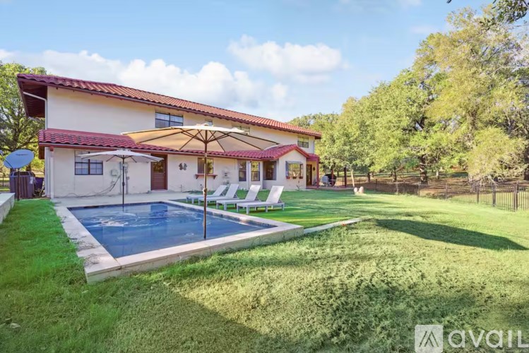 A house with a pool in the backyard.