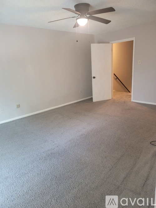 A room with a window and a tiled floor.