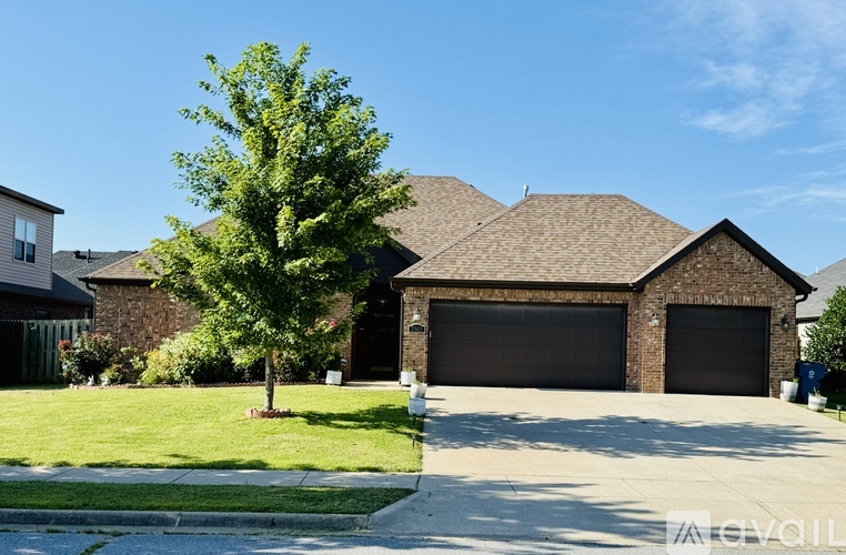 A house with a tree in front of it.
