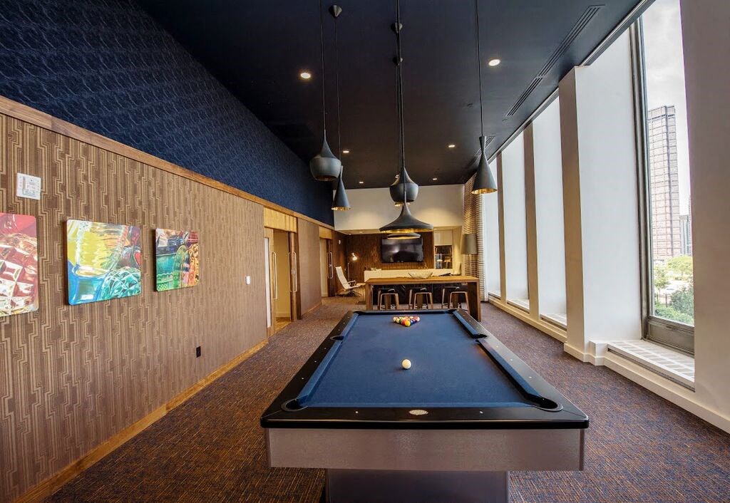 a billiards table in a room with a pool