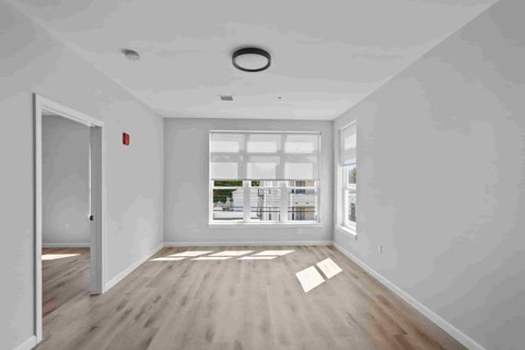 A room with a window and a door is shown.