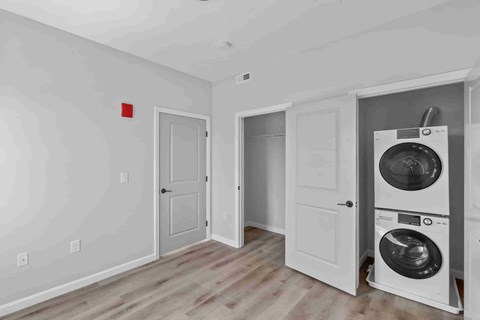 A laundry room with a washer and dryer in it.