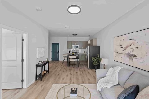 A modern living room with a grey sofa and a coffee table.