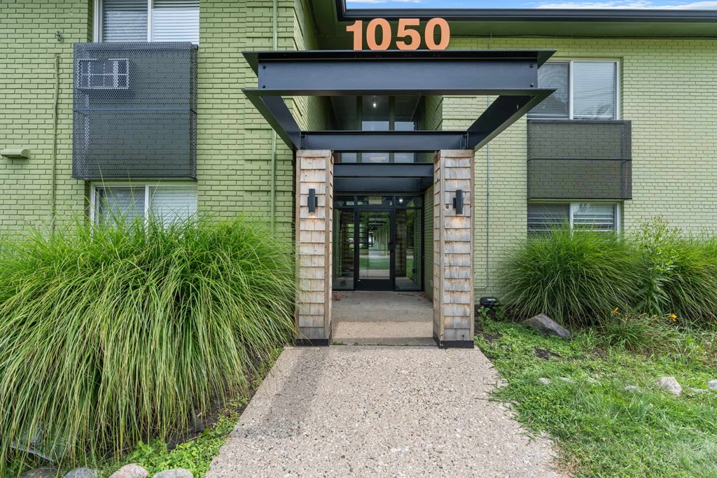 The image shows the entrance to a building with the number 1050 on it.