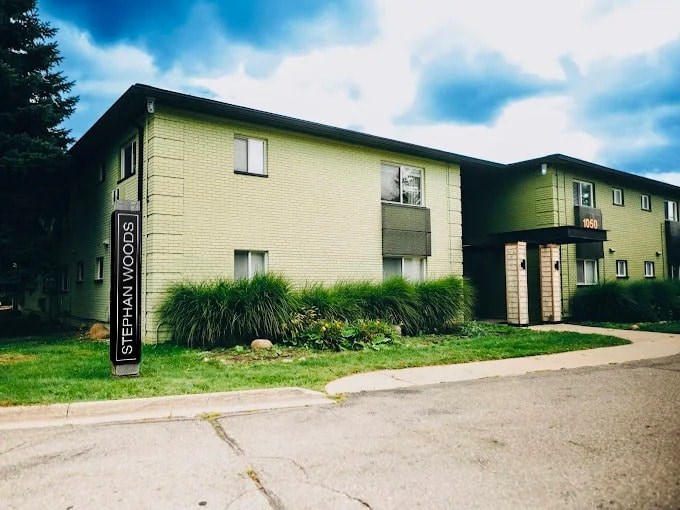 The image shows a building with a sign that reads "Stephan Woods".