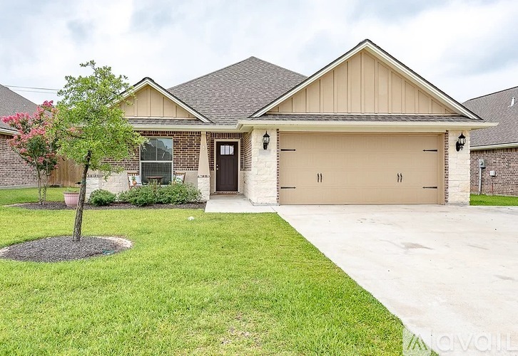 A house with a brown roof and a brown garage door.
