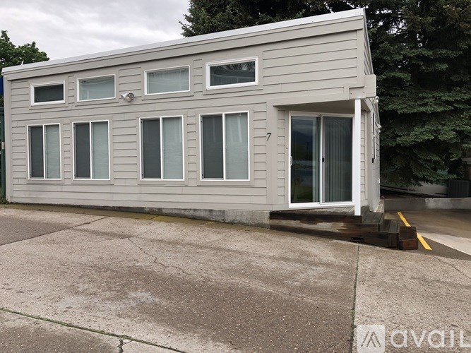 A grey building with the number 7 on the door.