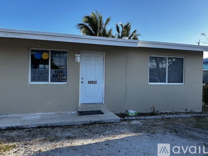 A house with a white door and a sign that says "FOR RENTS" is available for rent.