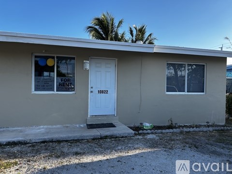 A house with a white door and a sign that says "FOR RENTS" is available for rent.