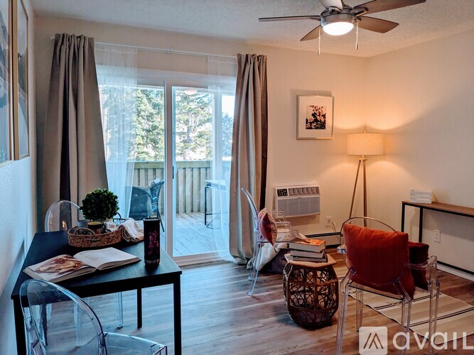A living room with a sliding glass door leading to a balcony.