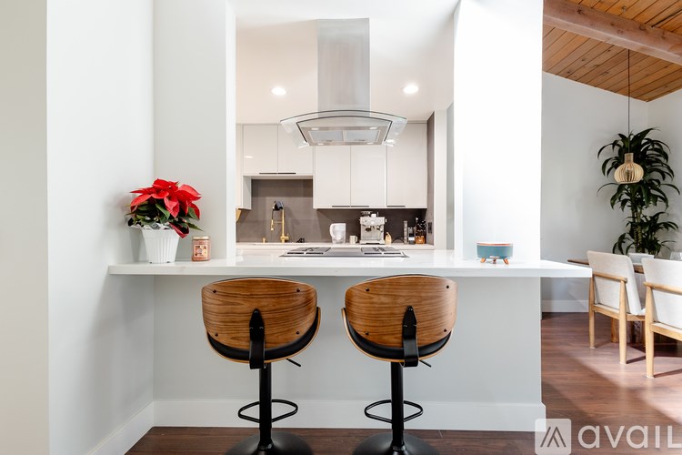 Two bar stools with a counter in the background.