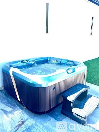 A hot tub with a blue light on it.