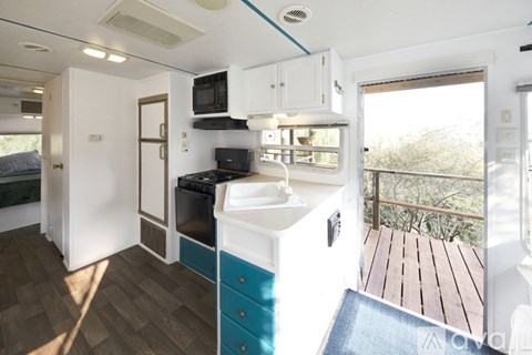 A small kitchen with a sink and a window.