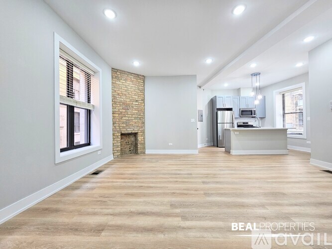 A modern kitchen with a white countertop and grey cabinets.