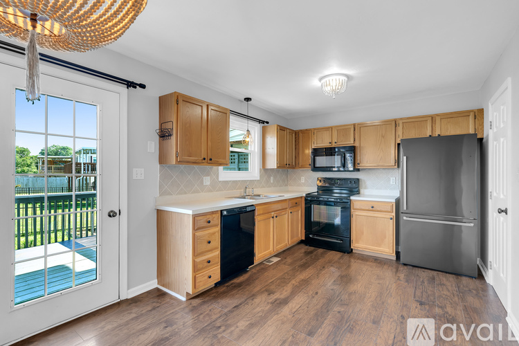 A kitchen with wooden cabinets and stainless steel appliances.