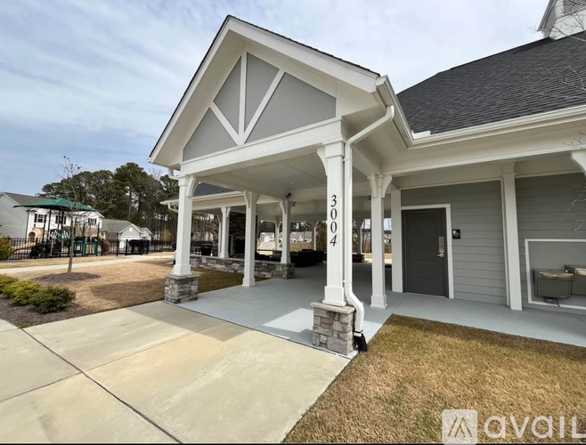 A house with the number 304 on the front porch.