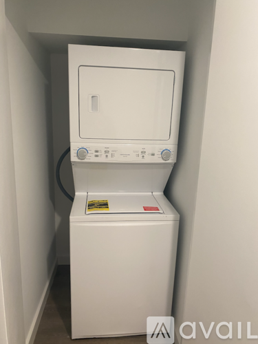 A white washing machine in a small space.