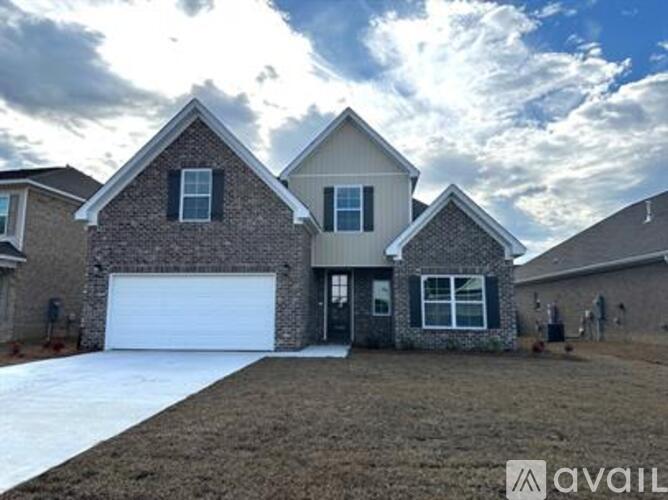 A house with a garage is available for sale.