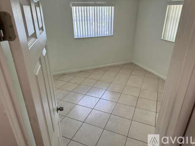 A bathroom with a toilet, sink, and shower curtain.