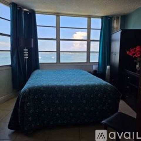 A kitchen with wooden cabinets and a granite countertop.