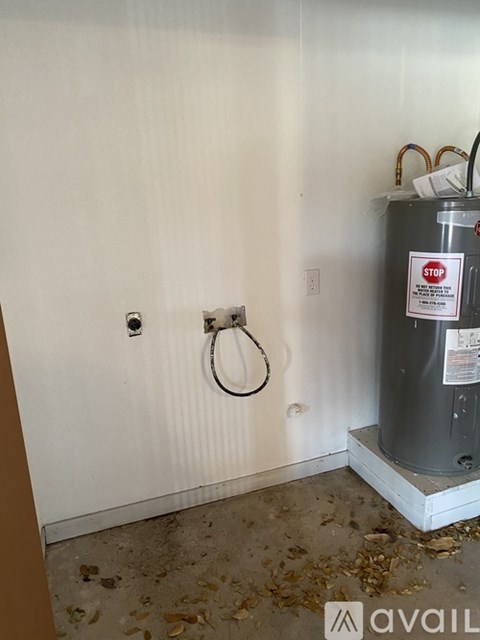 A wall-mounted heater with a stop sign on it.