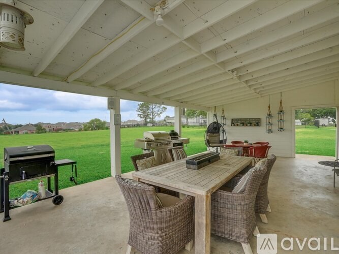 A patio with a table and chairs is available for rent.