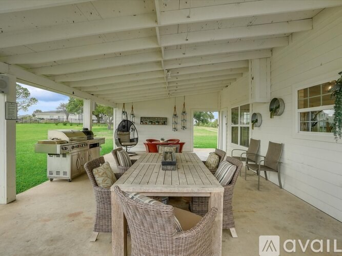 A patio with a table and chairs is available for rent.