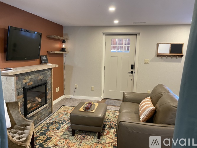 A living room with a fireplace and a couch.
