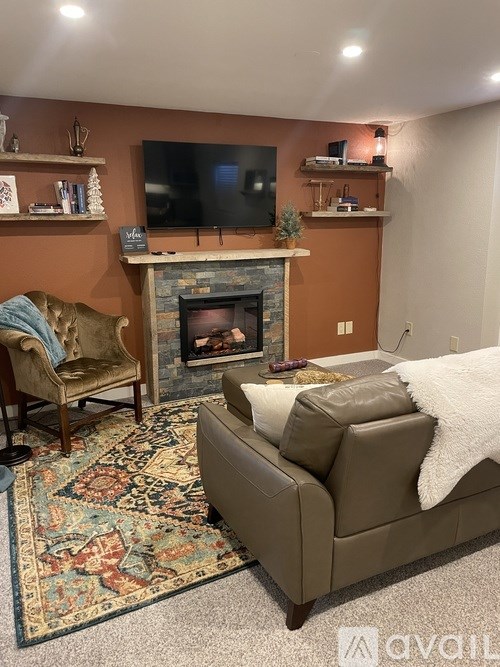 A living room with a fireplace and a couch.