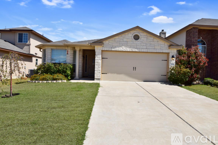 A house with a garage is available for rent.
