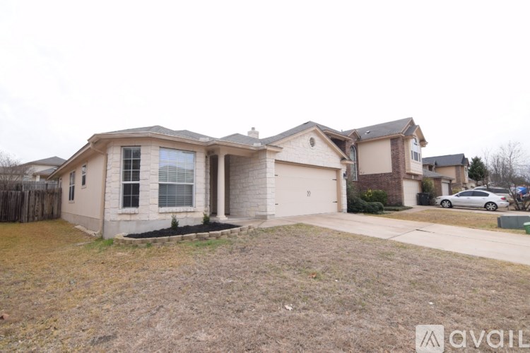 A house with a car parked in front of it.