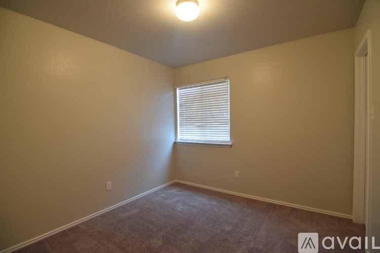 A house with a fence and a yard is for sale.