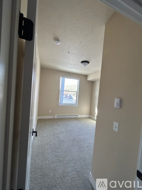 A kitchen with a refrigerator, oven, and microwave.