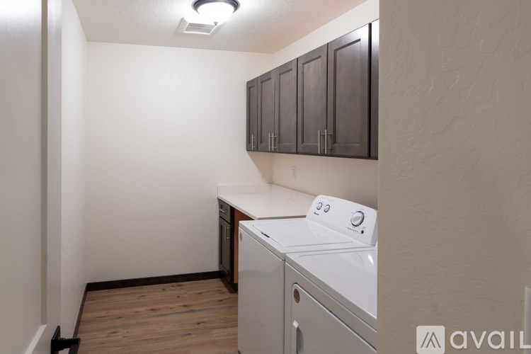 A small laundry room with a washer and dryer.