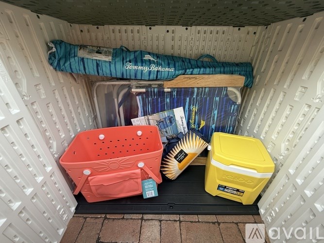 A Tommy Bahama branded item is on top of a white container.