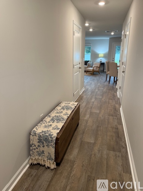 A floor plan of an apartment with three bedrooms and two bathrooms.