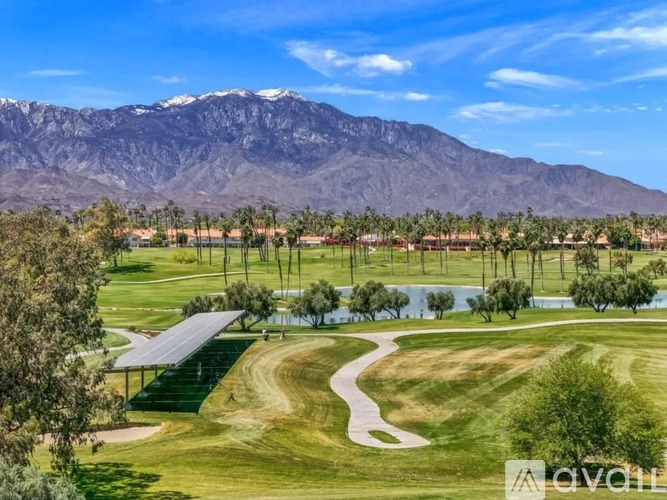 A golf course with a mountain in the background.