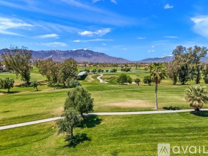 A golf course with a mountain in the background.
