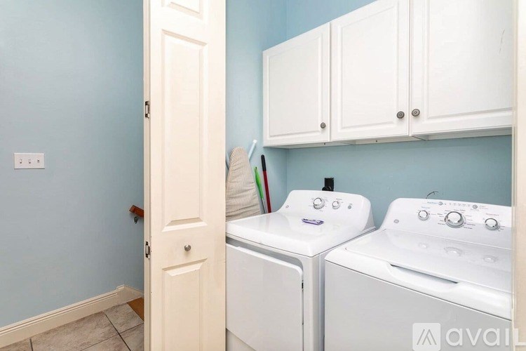 A laundry room with a washer and dryer.