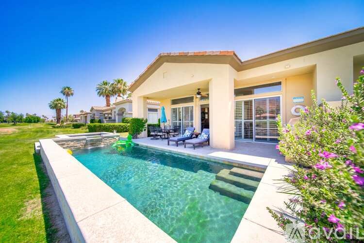 A house with a pool in the backyard.