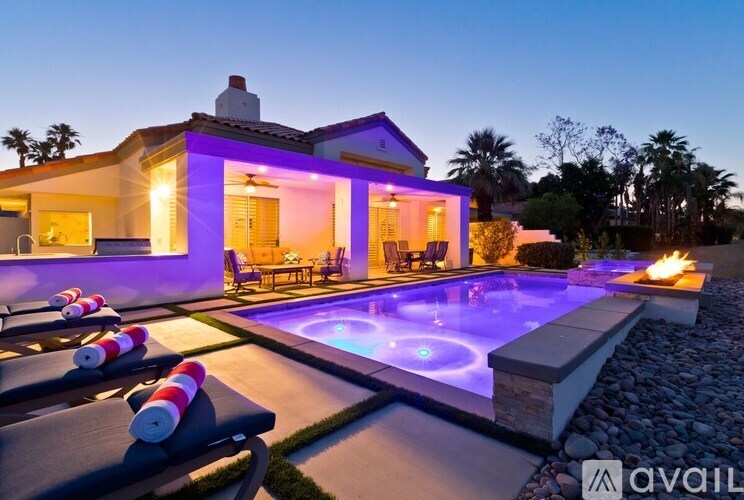 A modern house with a pool in the backyard.