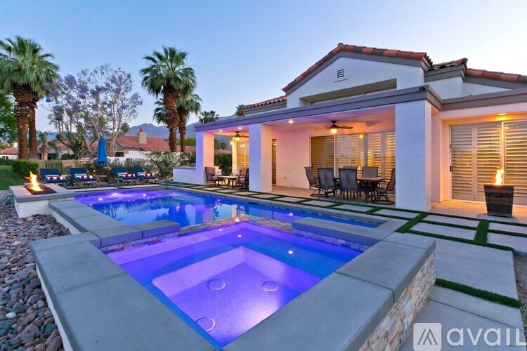 A house with a pool in the backyard.