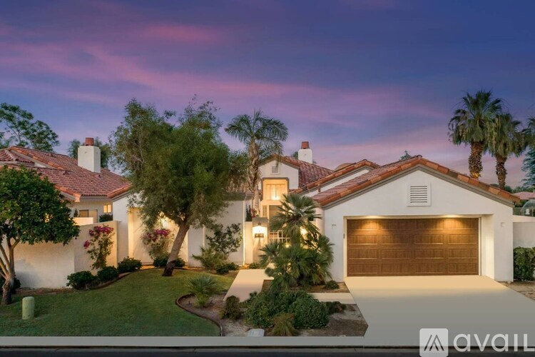 A house with a garage is available for sale.