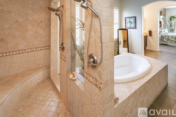 A bathroom with a tub and a walk-in shower.