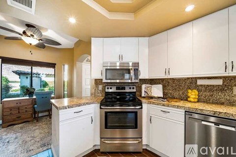 A kitchen with a stove top oven and a dishwasher.